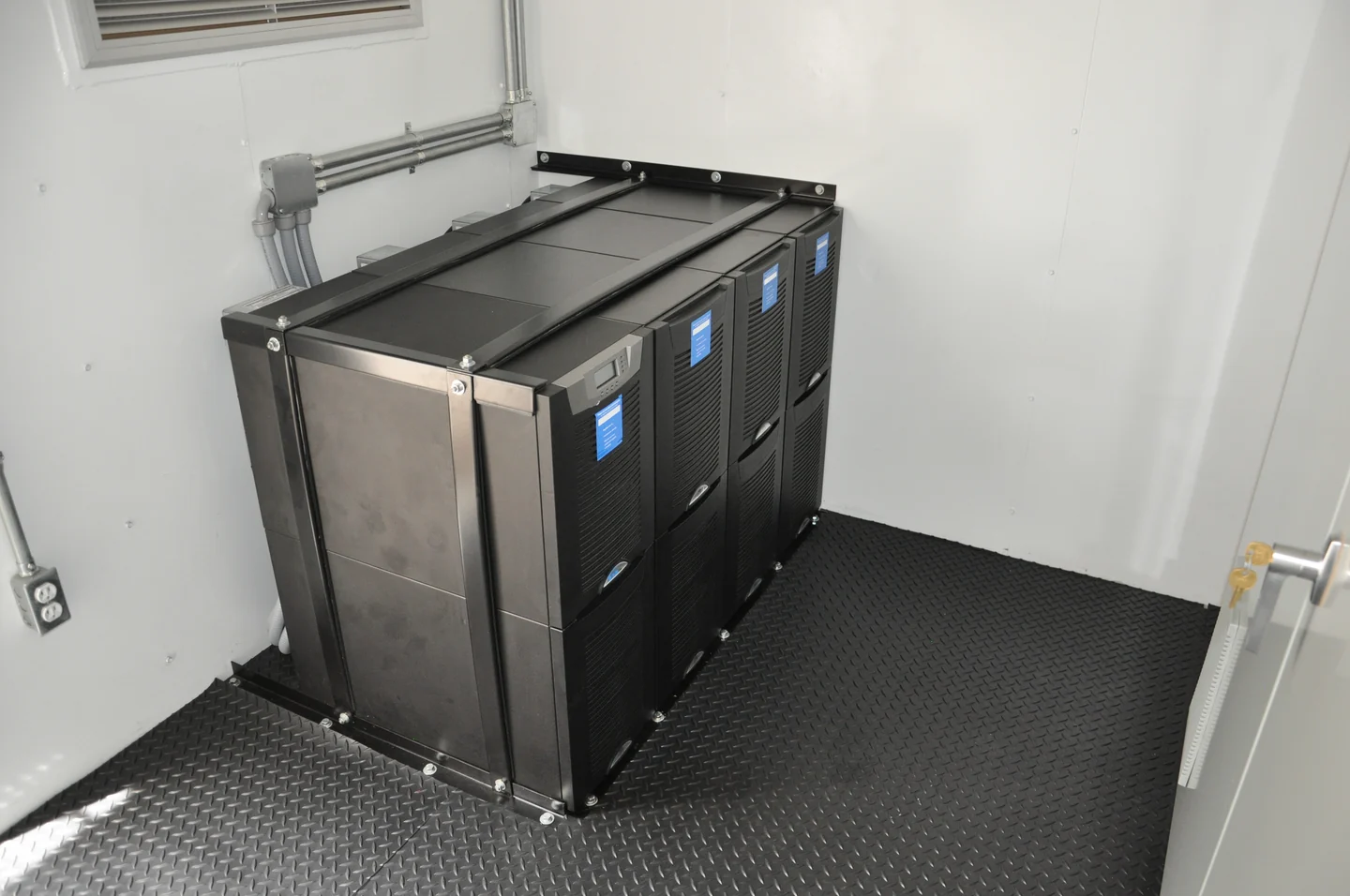 Power and control cabinets inside an enclosure