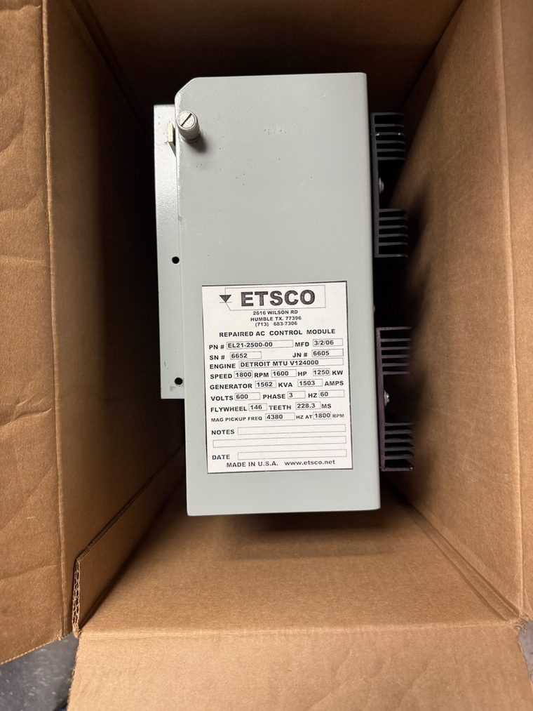 AC control module in a shipping carton with an ETSCO label reading Repaired AC Control Module, PN EL21-2500-00